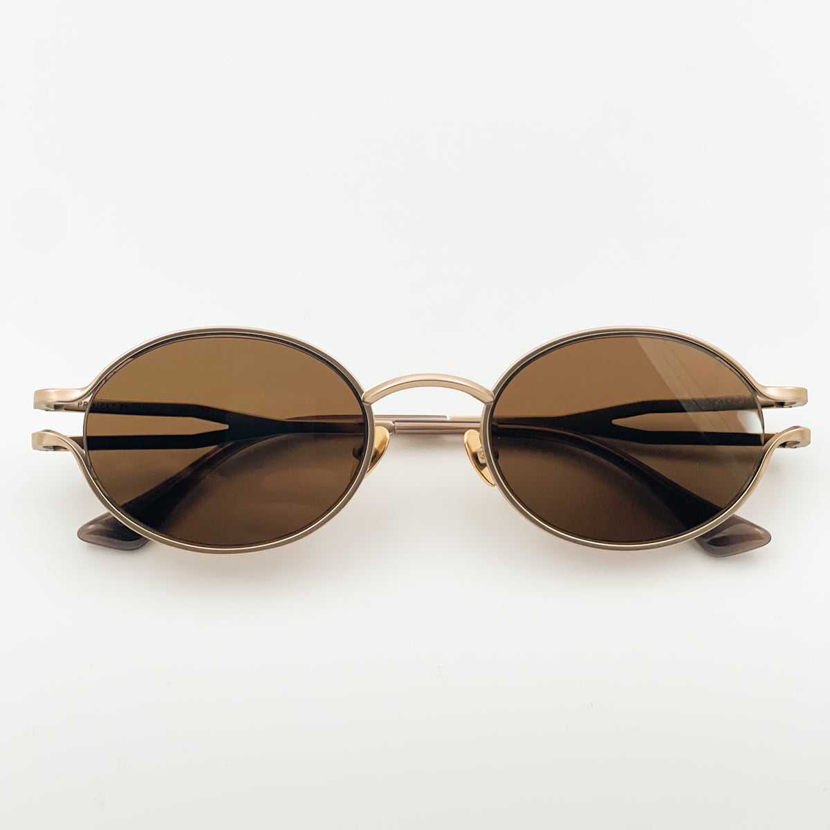 Projekt Produkt HM3 rocchiali da sole unisex montatura ovale in titanio spazzolato color oro bronzato